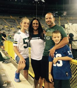 Sam Abraham, Owner of Level Headed Mudjackers, with family at Packers game